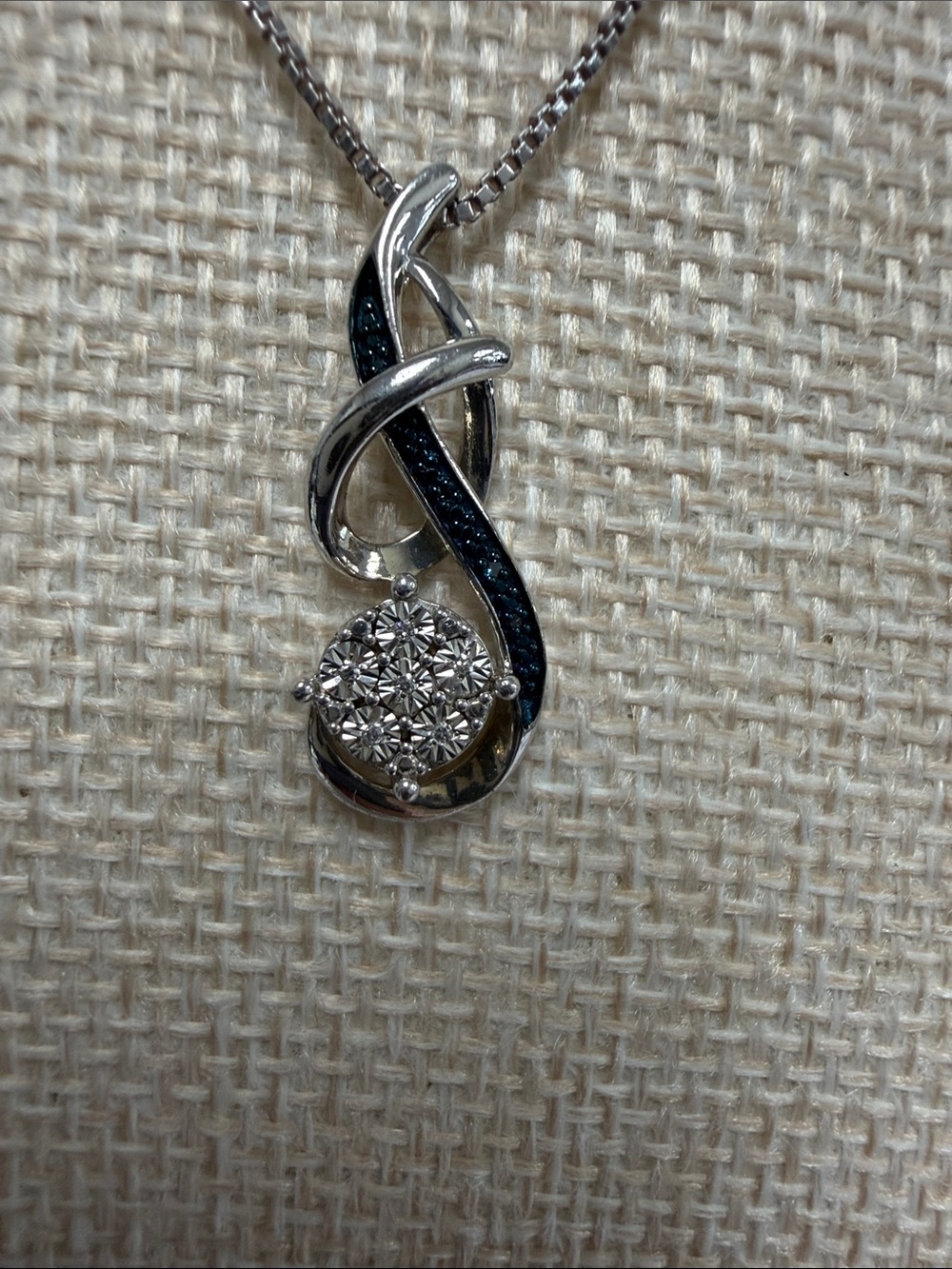 Sterling Silver Swirl Pendant Necklace with Blue and White diamonds